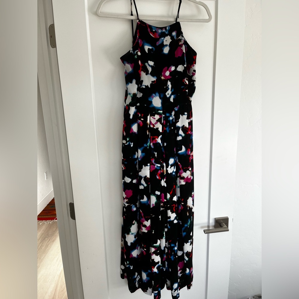 Jumpsuit size 4, worn twice. Really comfortable and fun!